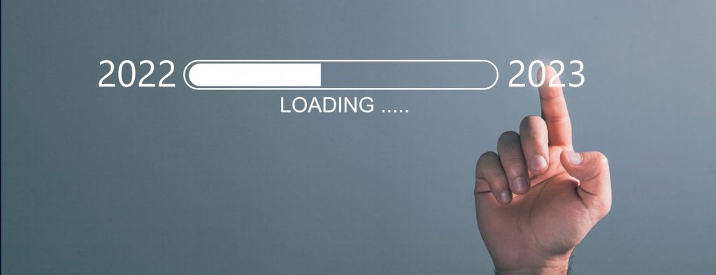 Loading bar with a hand pointing to 2023.
