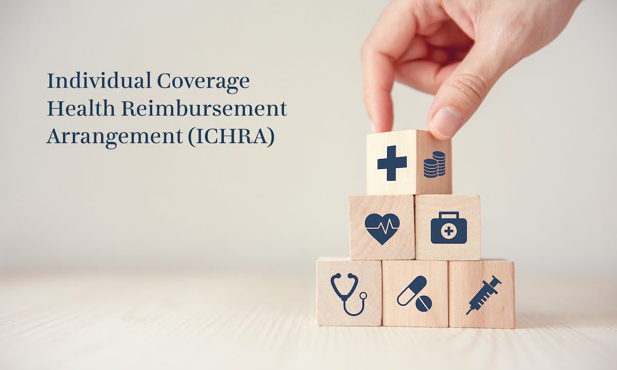 Health care symbols including a medical icon, syringe and stethoscope are shown on building blocks. Concept of ICHRA for consumers who are purchasing health insurance. 